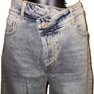 Women’s blue jeans asymmetrical shorts with fringe brand new.